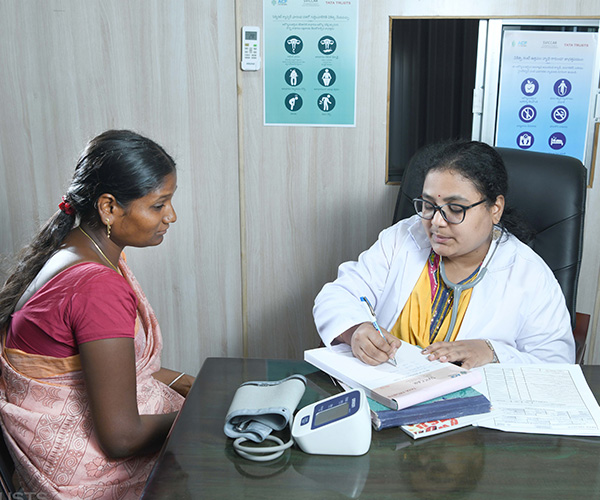 A doctor consulting a patient at SVICCAR Day Care